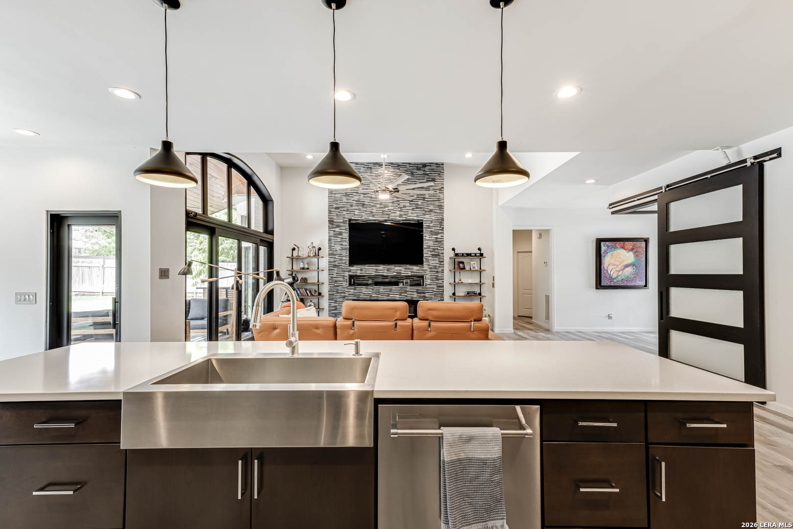 15919 Mission Ridge San Antonio, TX 78232 - Photo 22 of 43 a kitchen with a sink a counter and chairs
