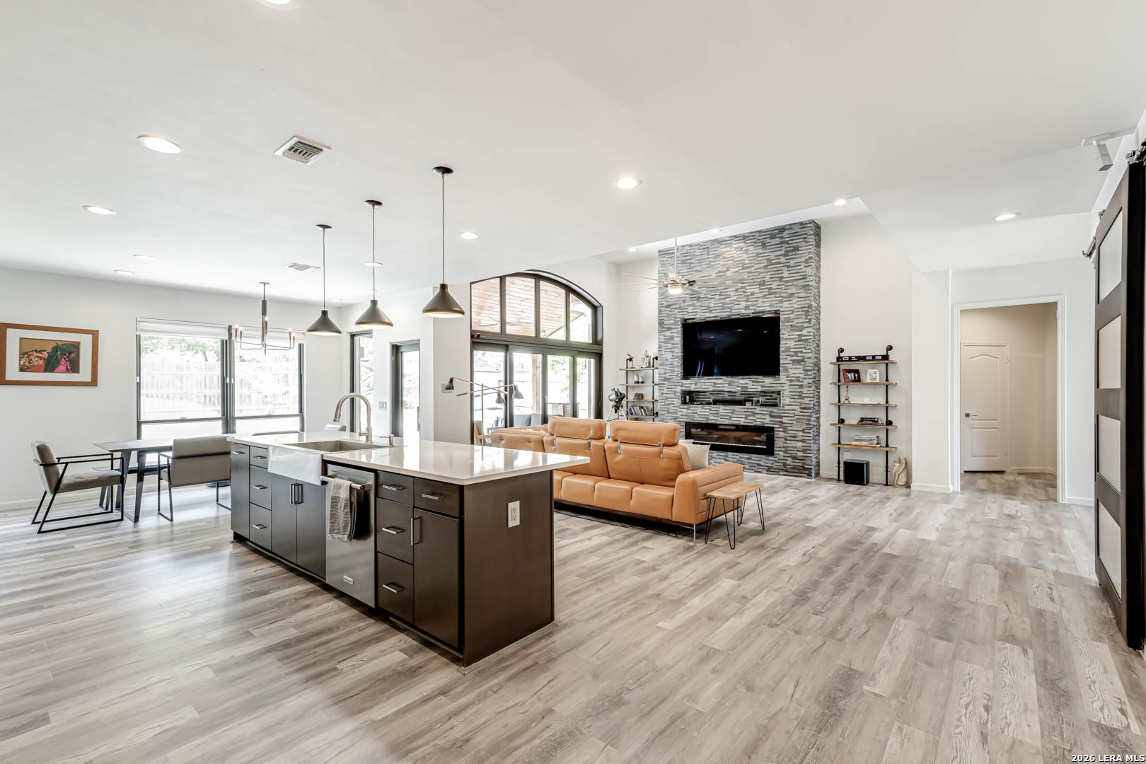 15919 Mission Ridge San Antonio, TX 78232 - Photo 23 of 43 a living room with fireplace furniture and a flat screen tv