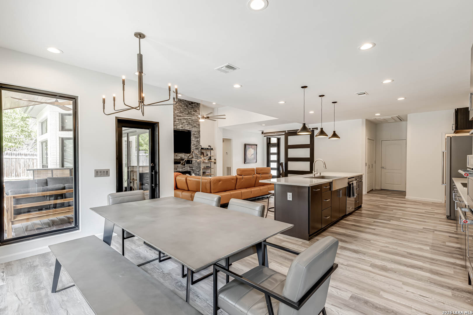 15919 Mission Ridge San Antonio, TX 78232 - Photo 25 of 43 a living room with furniture kitchen view and a wooden floor