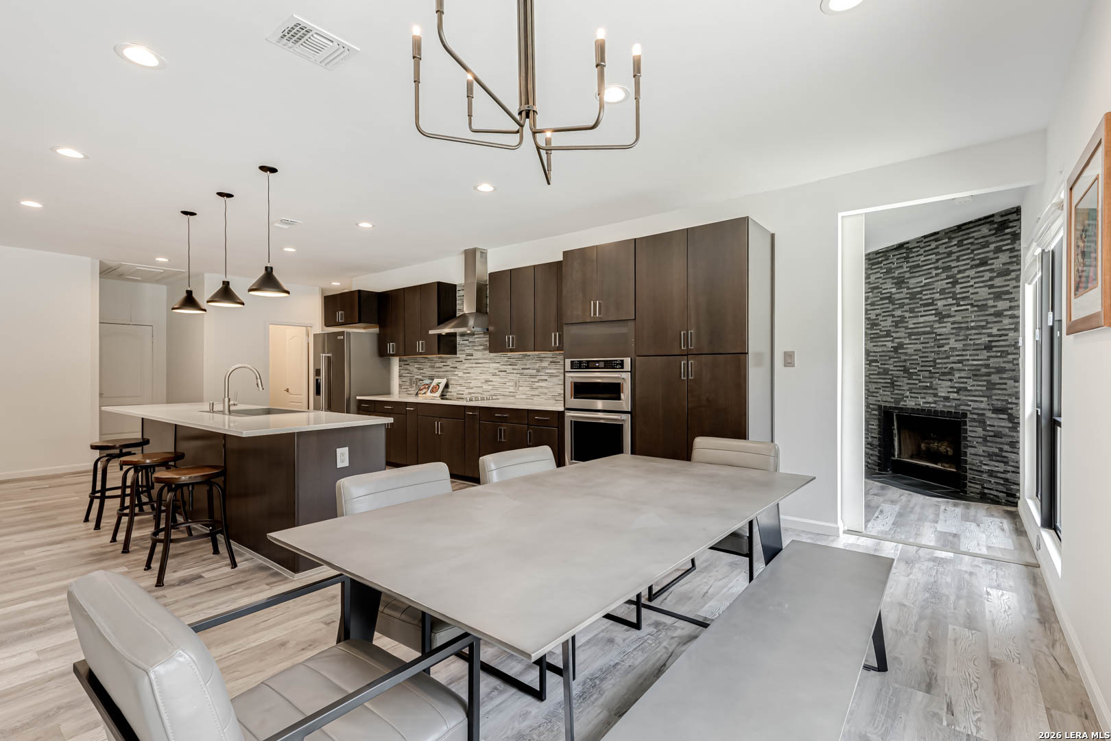15919 Mission Ridge San Antonio, TX 78232 - Photo 26 of 43 a large kitchen with a table and chairs