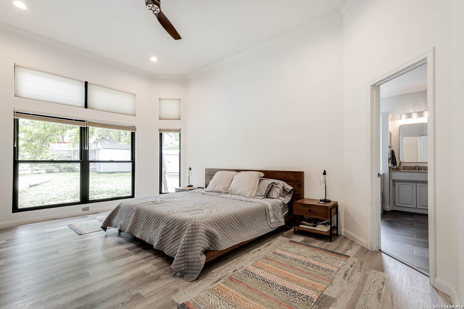 15919 Mission Ridge San Antonio, TX 78232 - Photo 28 of 43 a spacious bedroom with a bed and a large window