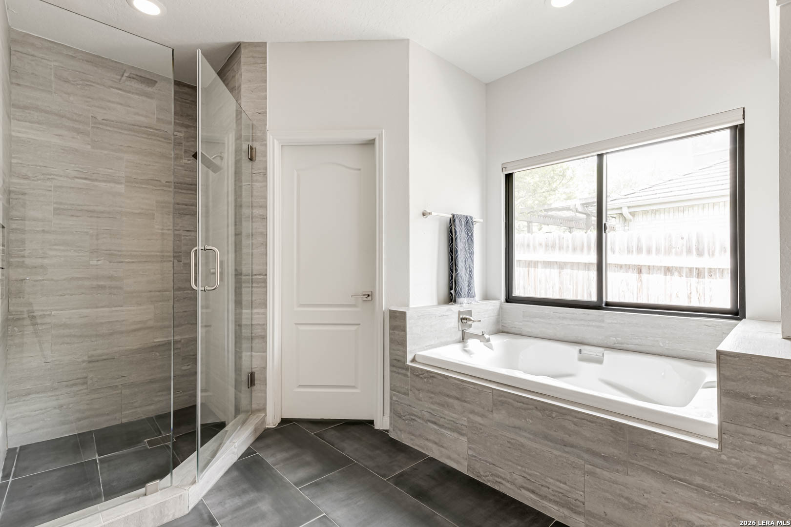 15919 Mission Ridge San Antonio, TX 78232 - Photo 30 of 43 a bathroom with a bathtub and shower