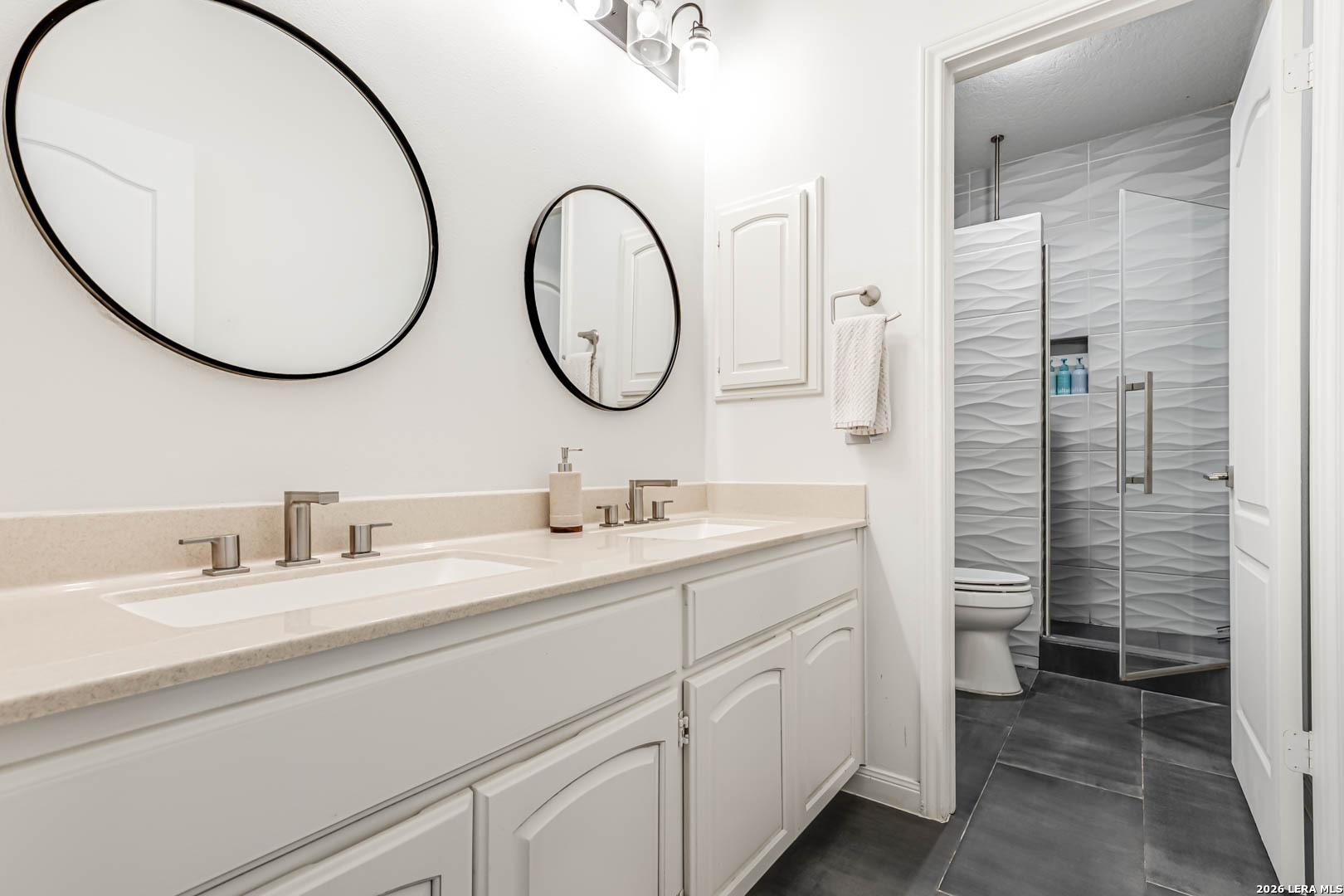 15919 Mission Ridge San Antonio, TX 78232 - Photo 32 of 43 a bathroom with a sink and a mirror