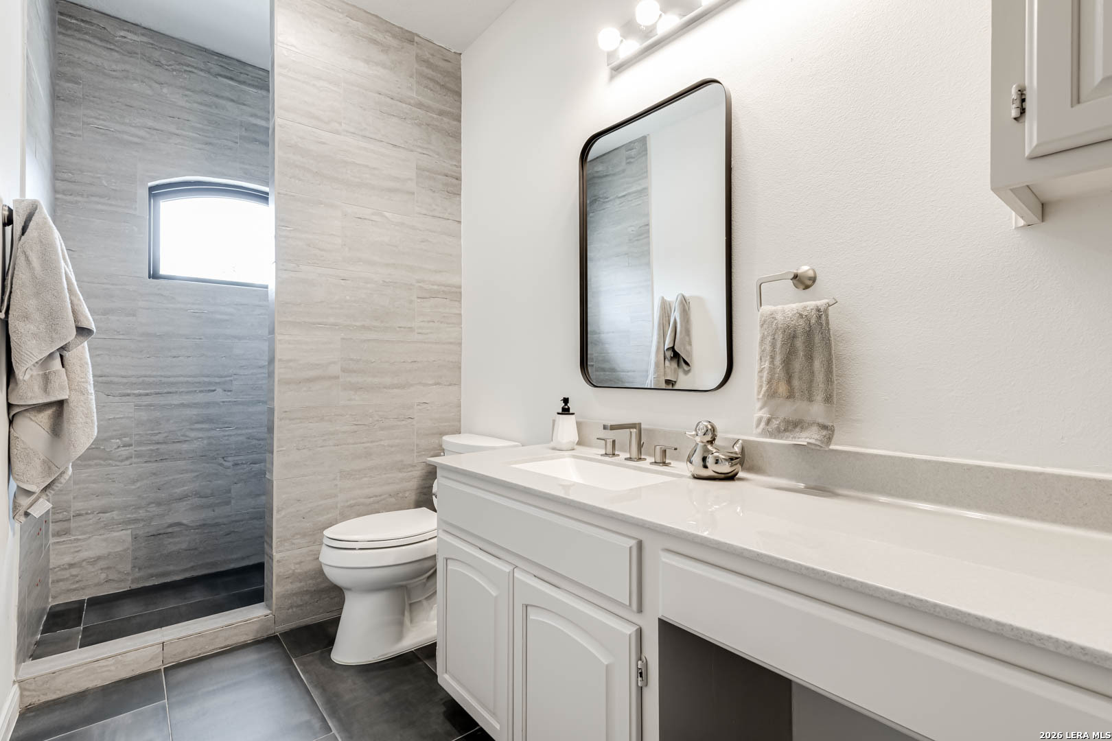 15919 Mission Ridge San Antonio, TX 78232 - Photo 35 of 43 a bathroom with a double vanity sink toilet and shower
