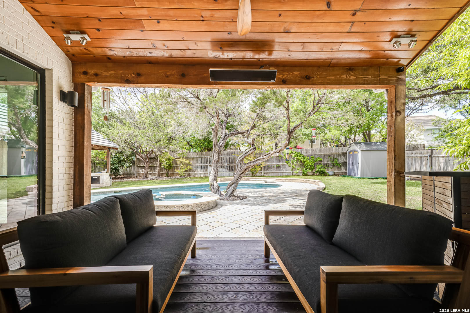 15919 Mission Ridge San Antonio, TX 78232 - Photo 37 of 43 a living room with couch and a floor to ceiling window