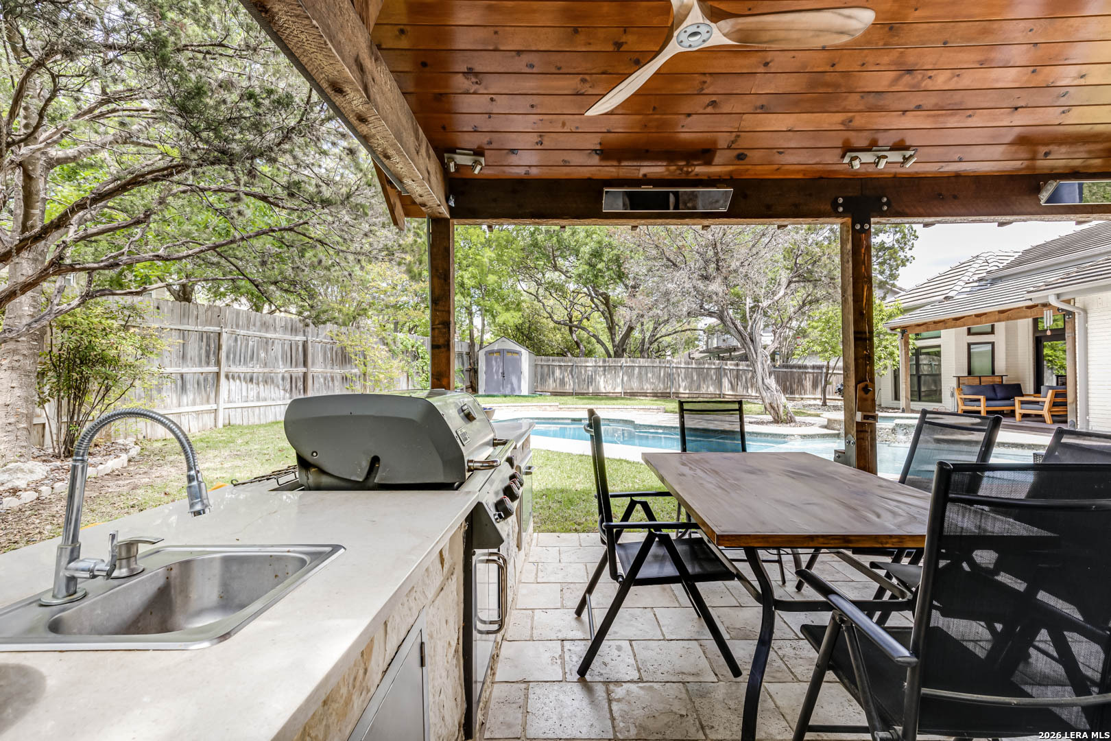 15919 Mission Ridge San Antonio, TX 78232 - Photo 41 of 43 a view of a patio with table and chairs a barbeque with wooden floor and fence