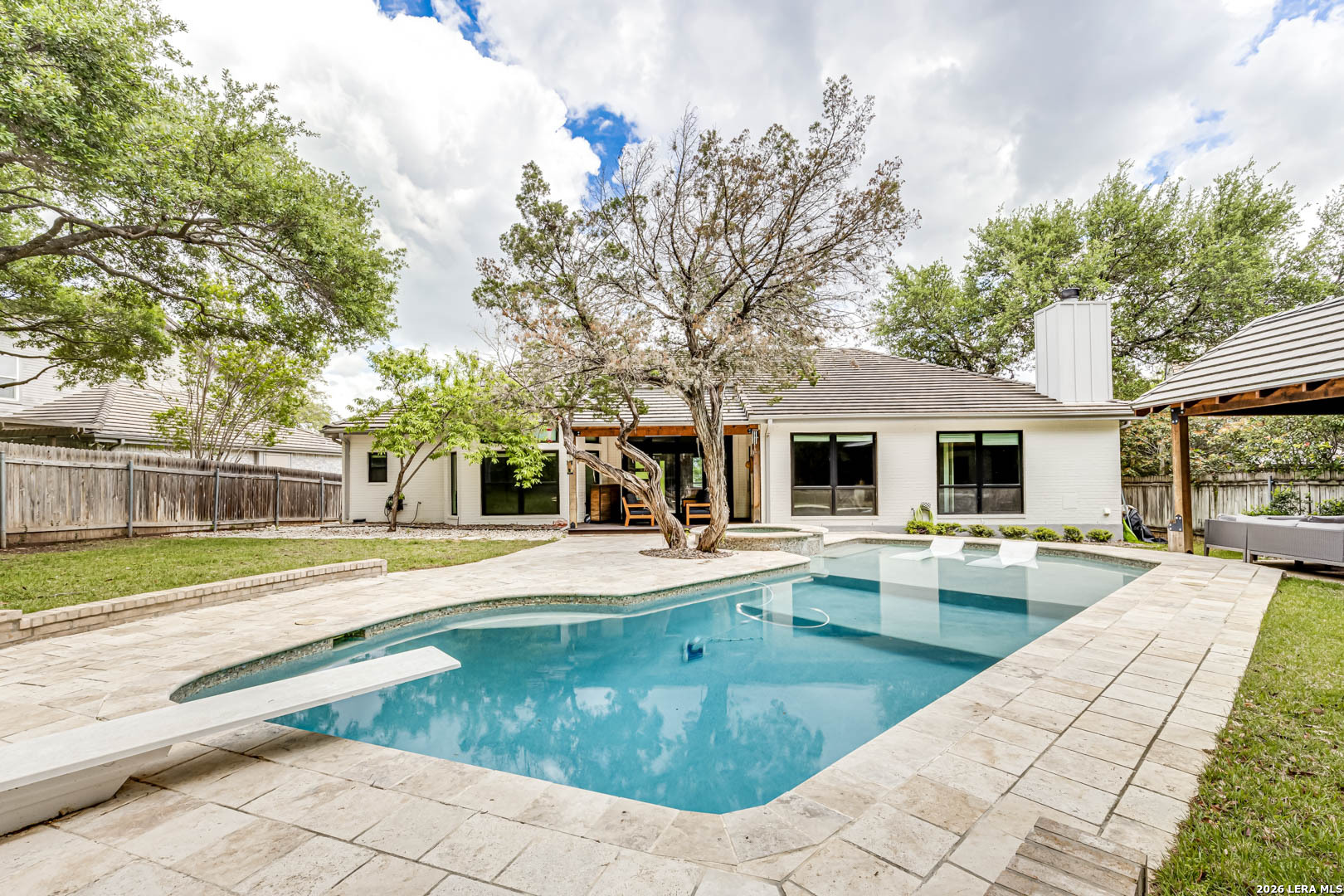 15919 Mission Ridge San Antonio, TX 78232 - Photo 43 of 43 a view of a house with swimming pool and sitting area