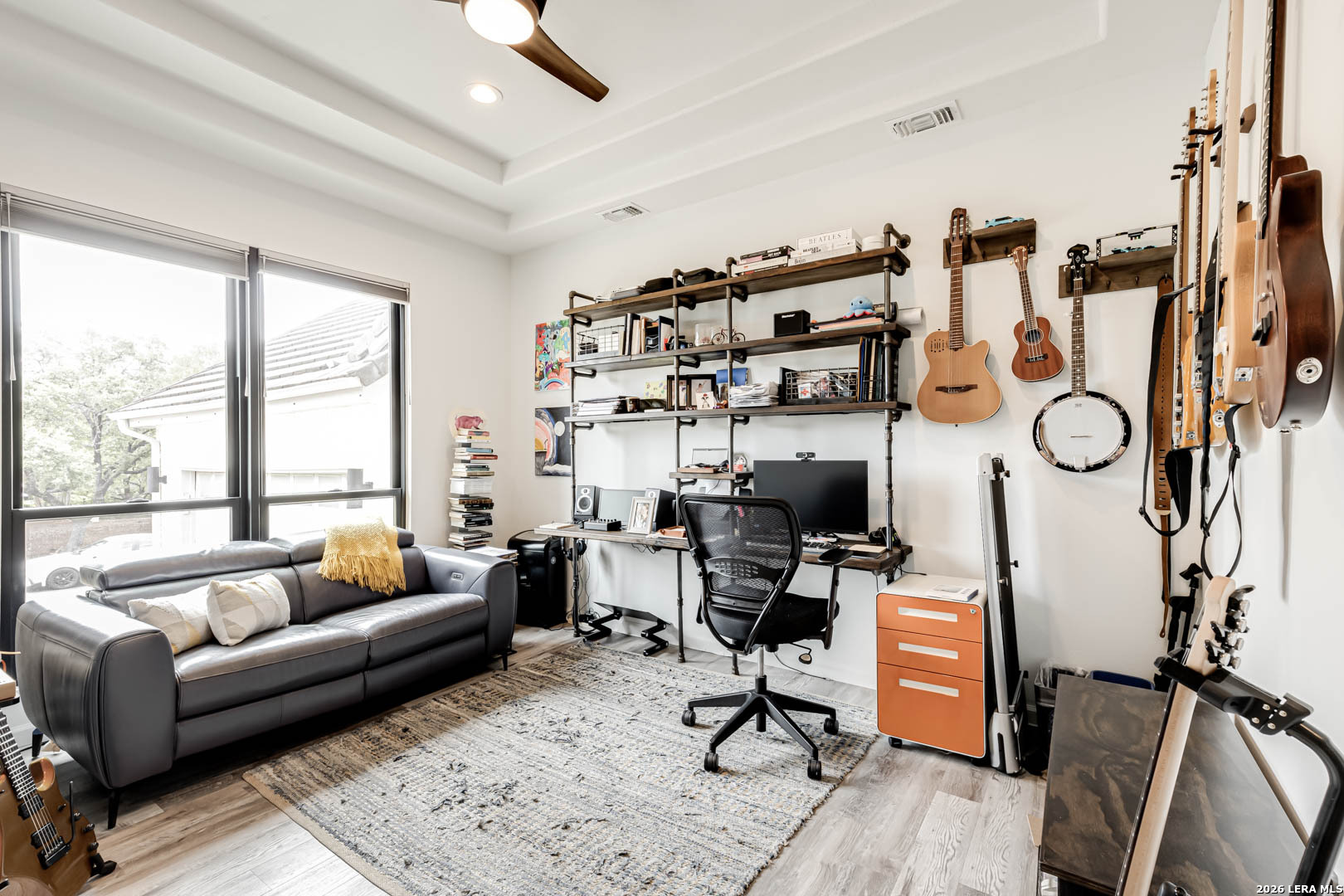 15919 Mission Ridge San Antonio, TX 78232 - Photo 8 of 43 a living room with furniture gym equipment and a large window