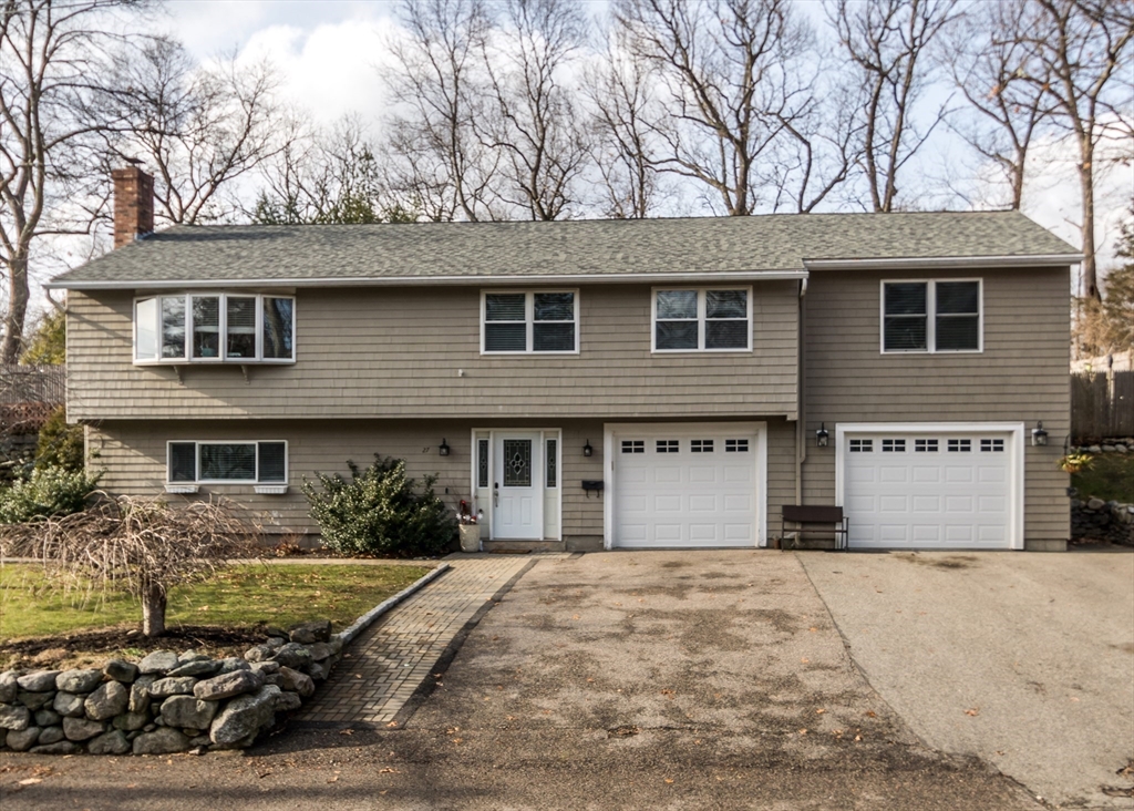 a front view of a house with yard