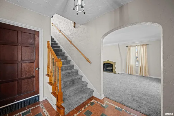 a view of a hallway with staircase