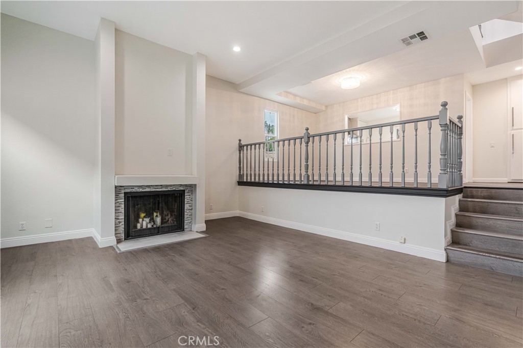 415 East Mission Road, Unit 12 Alhambra, CA 91801 - Photo 6 of 28 High Ceiling Living Room and Dining Area with a Gas Fireplace