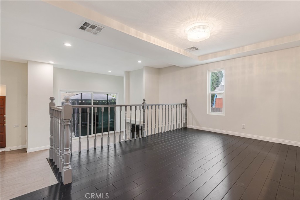 415 East Mission Road, Unit 12 Alhambra, CA 91801 - Photo 9 of 28 High Ceiling Living Room and Dining Area with a Gas Fireplace