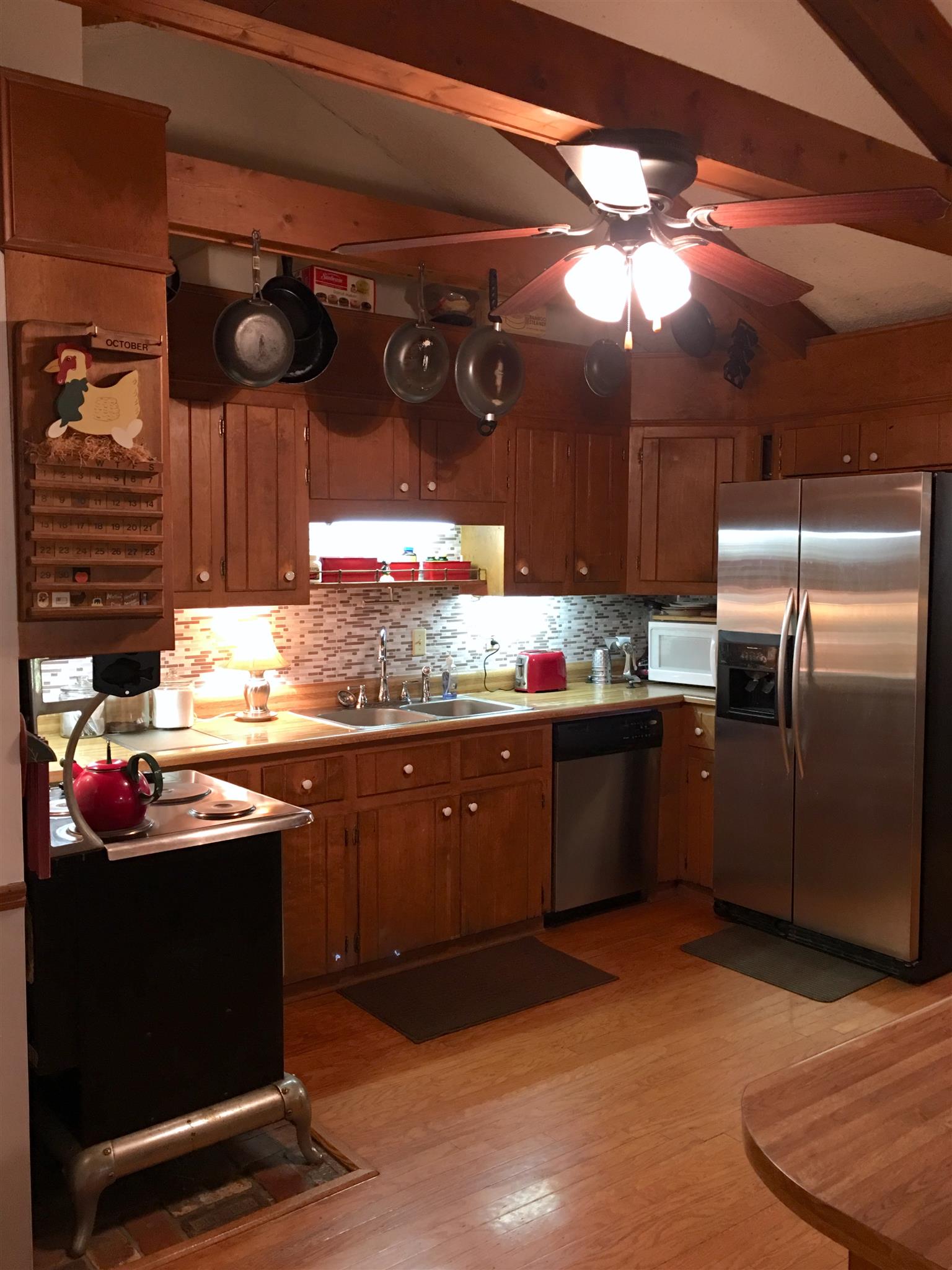 206 Bonnertown Road Five Points, TN 38457 - Photo 8 of 28 a kitchen with stainless steel appliances granite countertop a sink a stove and a wooden floors