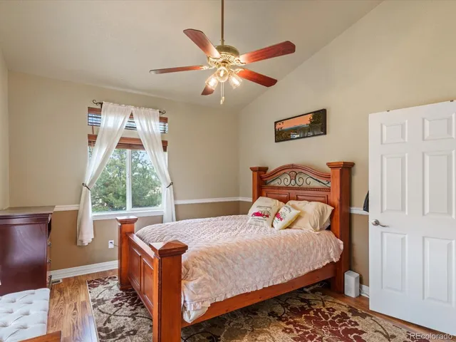 a bed room with a bed and a window