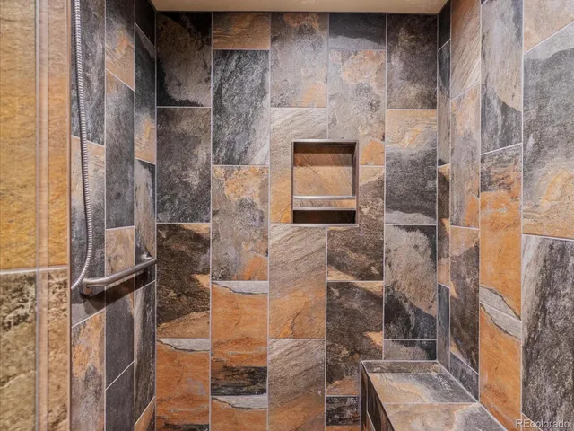 a bedroom with a bed and a desk