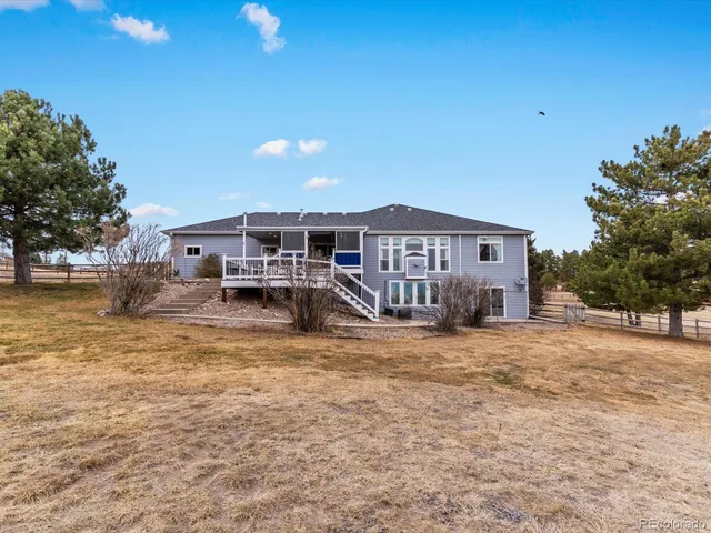 a view of a house with a big yard