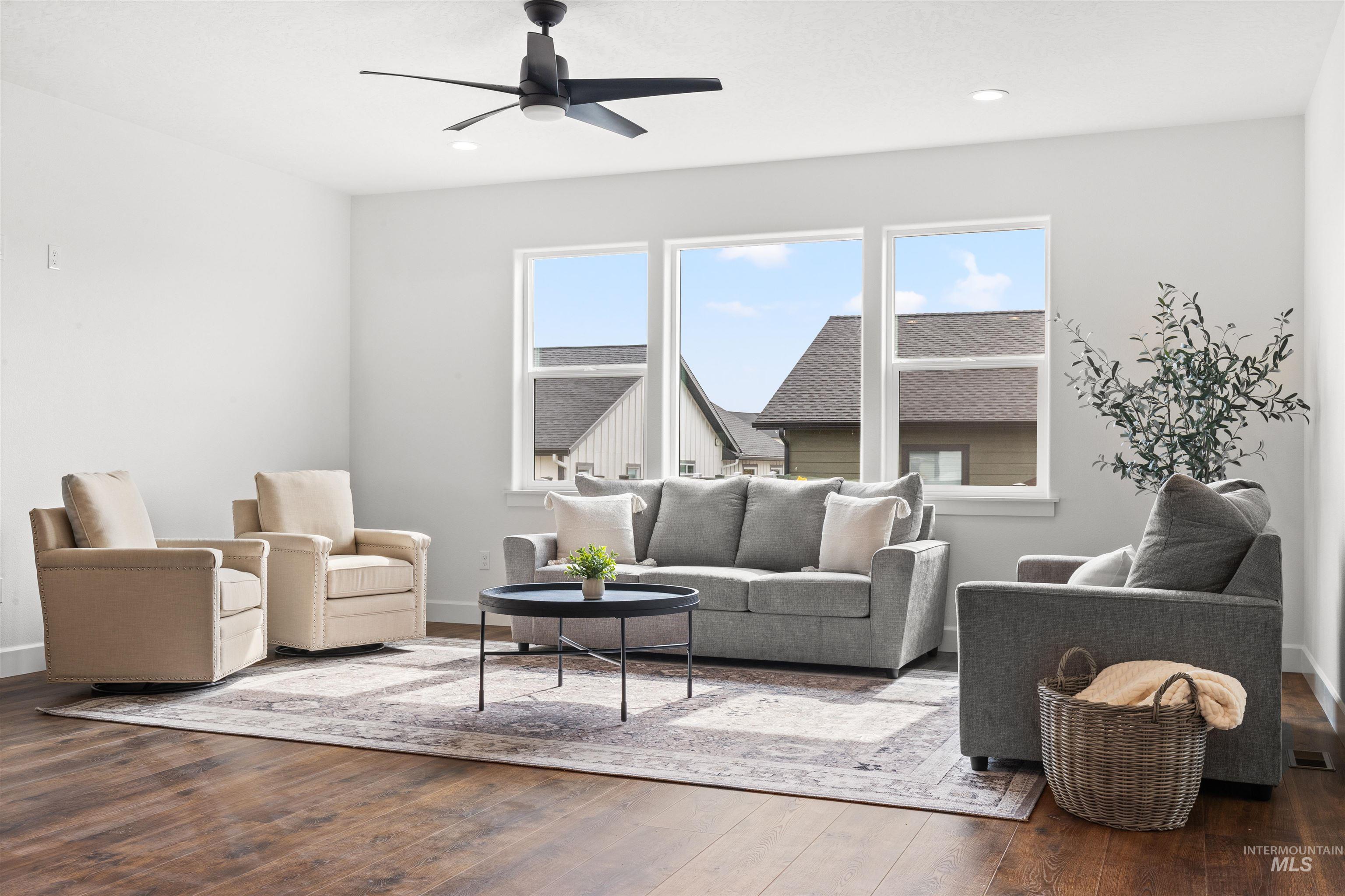 1724 Pathway Court Lewiston, ID 83501 - Photo 12 of 38 Living room featuring ceiling fan, hardwood / wood-style flooring, and healthy amount of natural light