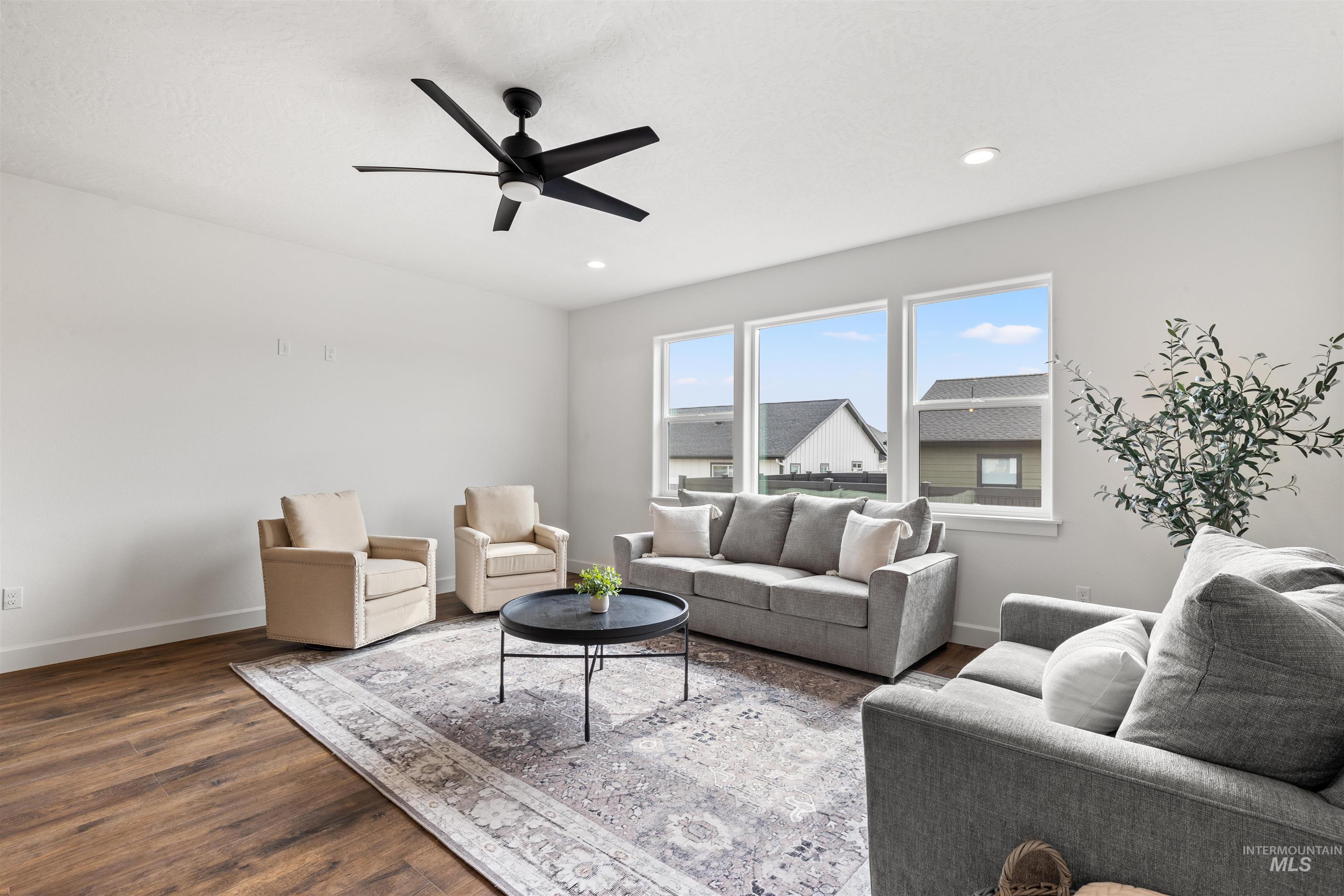 1724 Pathway Court Lewiston, ID 83501 - Photo 13 of 38 Living area featuring wood finished floors and ceiling fan