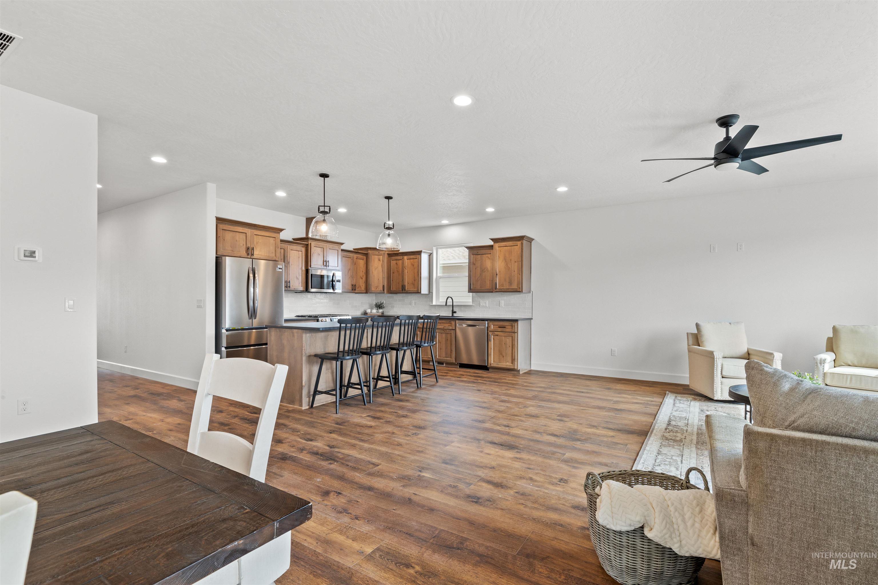 1724 Pathway Court Lewiston, ID 83501 - Photo 15 of 38 Living area featuring dark wood-type flooring, ceiling fan, and recessed lighting
