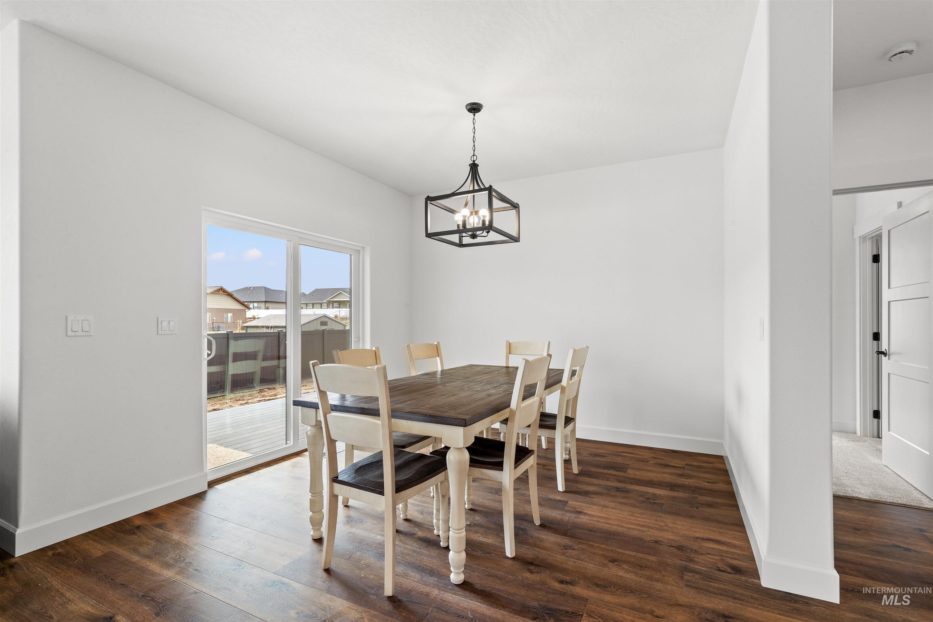 1724 Pathway Court Lewiston, ID 83501 - Photo 16 of 38 Dining area with dark wood-style floors and suspended lighting