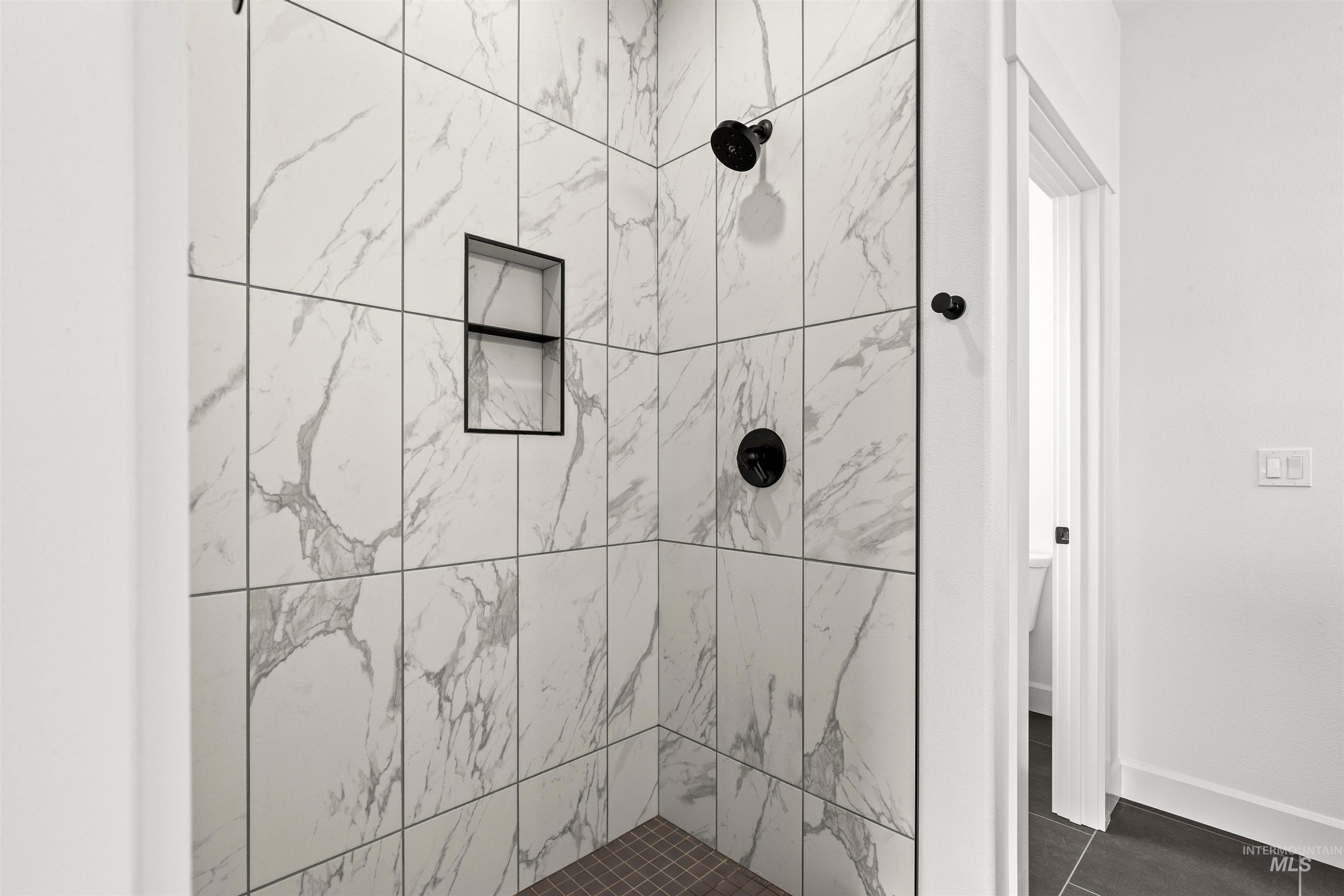 1724 Pathway Court Lewiston, ID 83501 - Photo 24 of 38 Full bathroom with a shower stall and dark tile patterned flooring