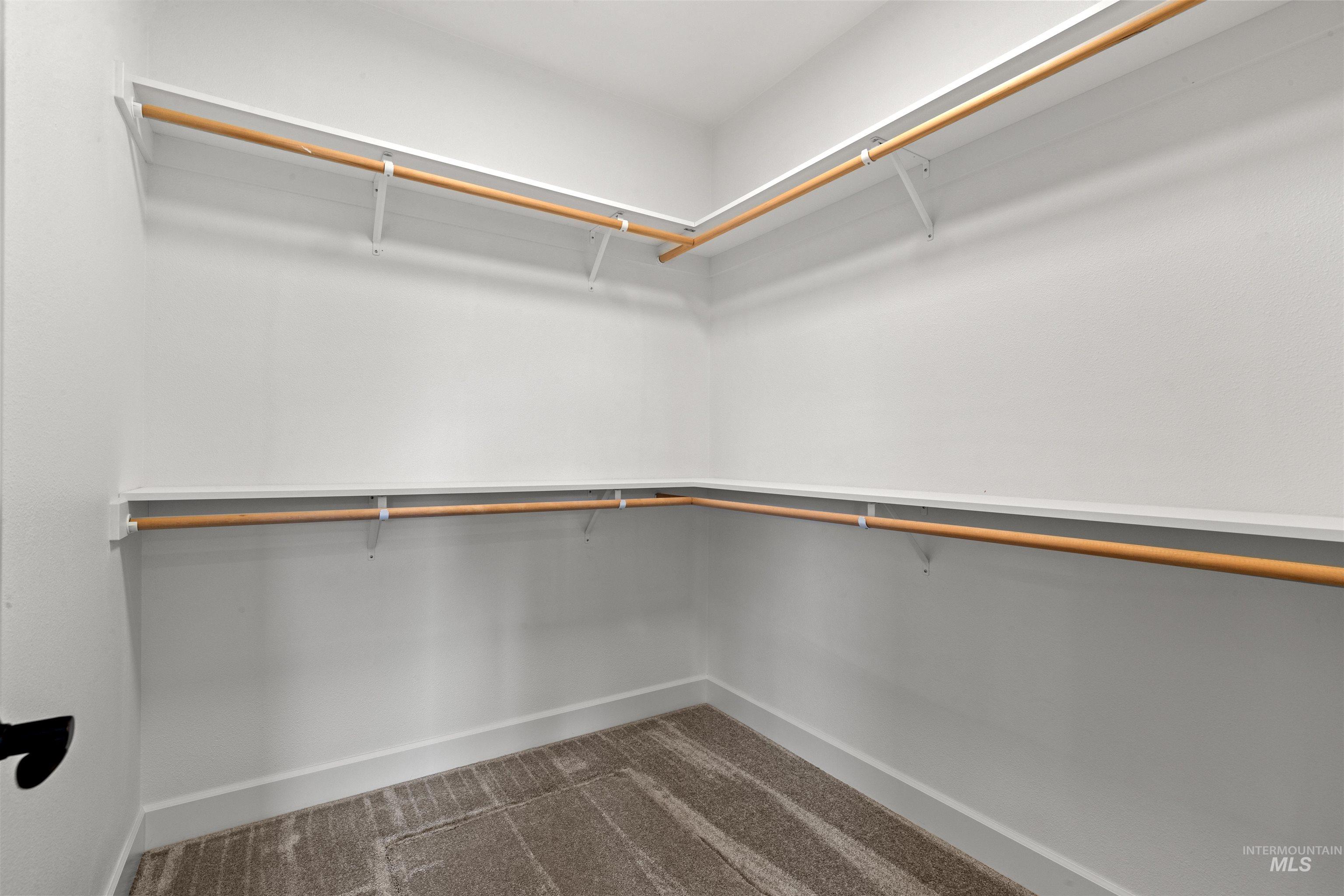 1724 Pathway Court Lewiston, ID 83501 - Photo 25 of 38 Walk in closet with dark colored carpet
