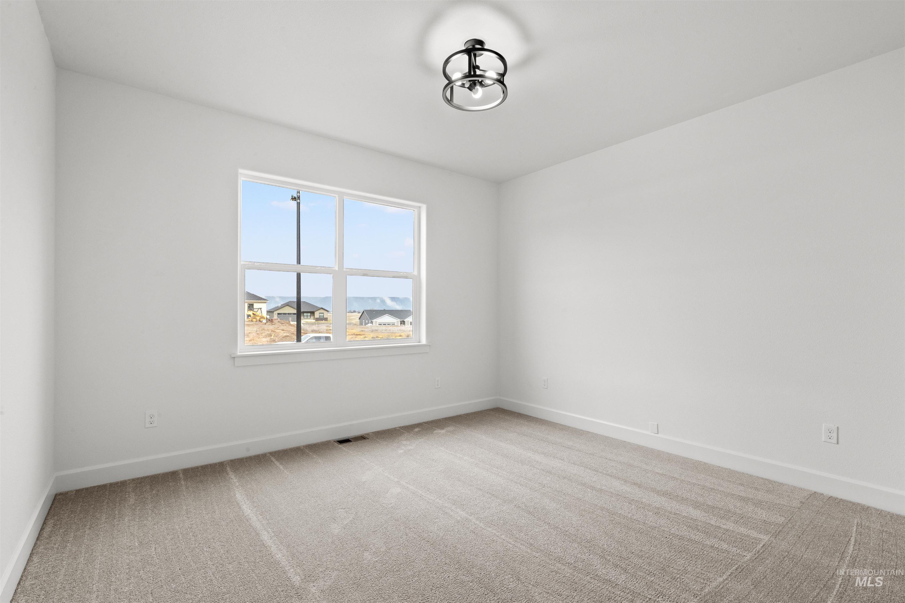 1724 Pathway Court Lewiston, ID 83501 - Photo 26 of 38 Empty room with baseboards and light colored carpet