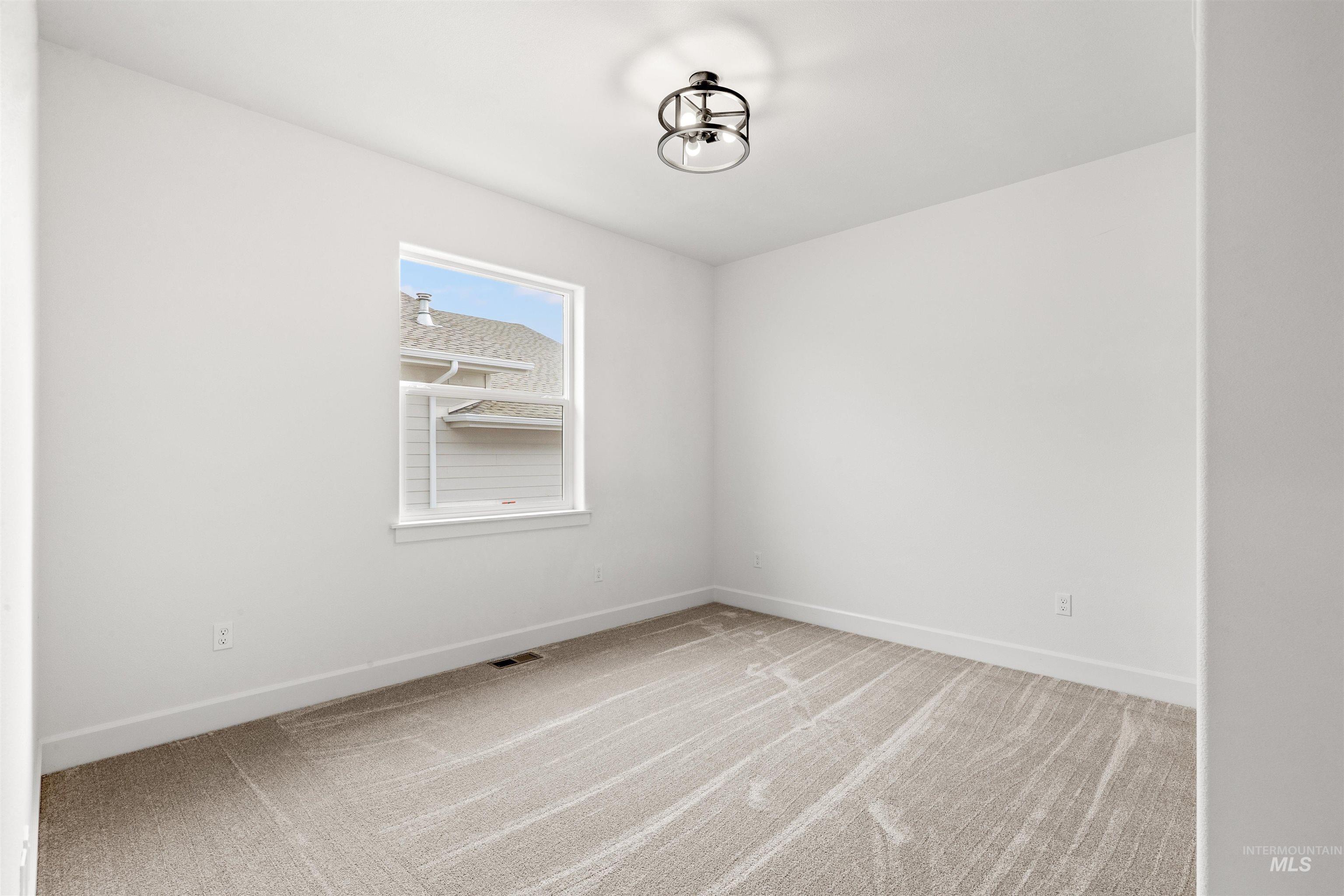 1724 Pathway Court Lewiston, ID 83501 - Photo 29 of 38 Empty room with baseboards and light colored carpet