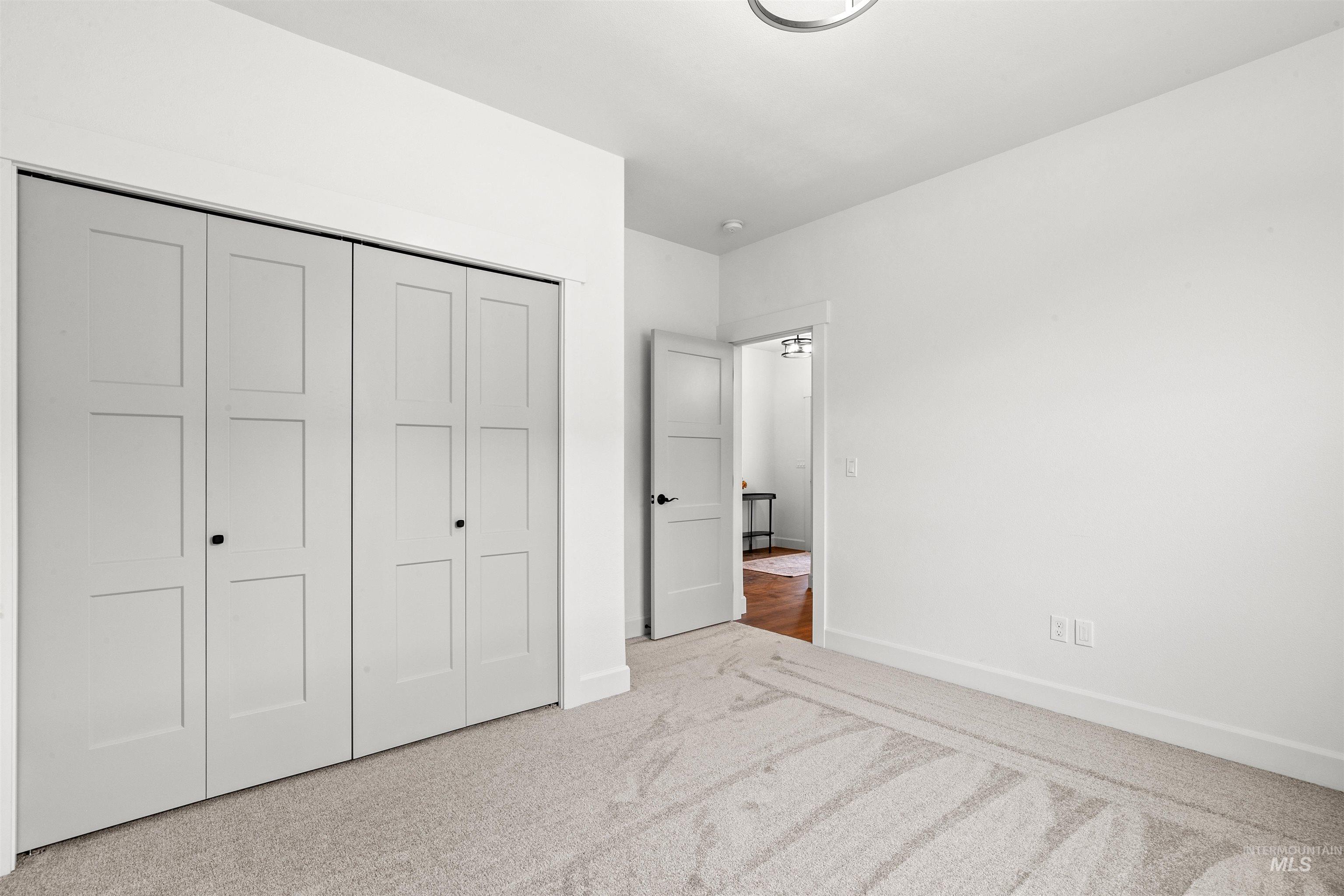 1724 Pathway Court Lewiston, ID 83501 - Photo 30 of 38 Unfurnished bedroom with light carpet and a closet