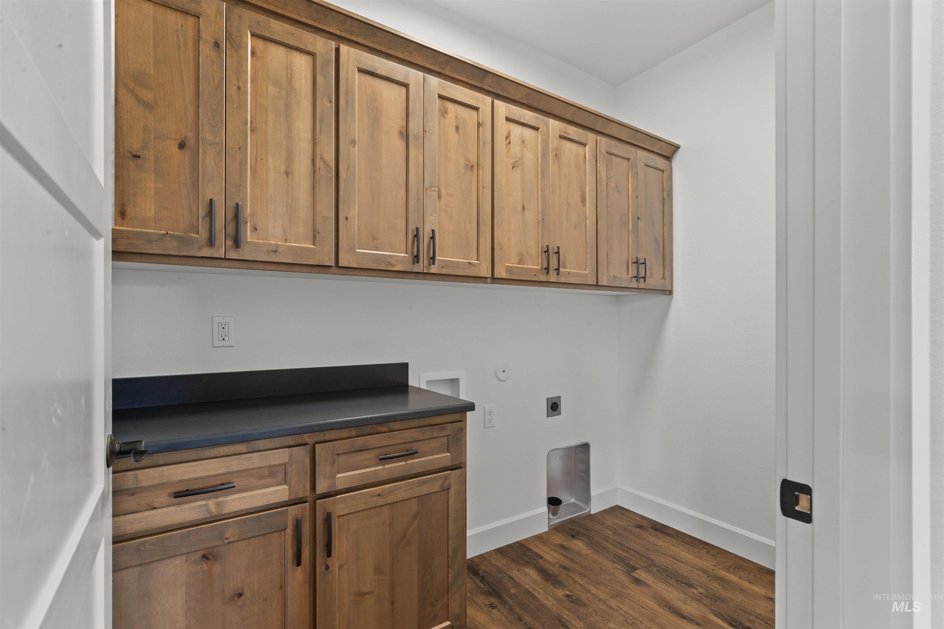 1724 Pathway Court Lewiston, ID 83501 - Photo 31 of 38 Laundry area with cabinet space, dark wood-style flooring, washer hookup, and electric dryer hookup