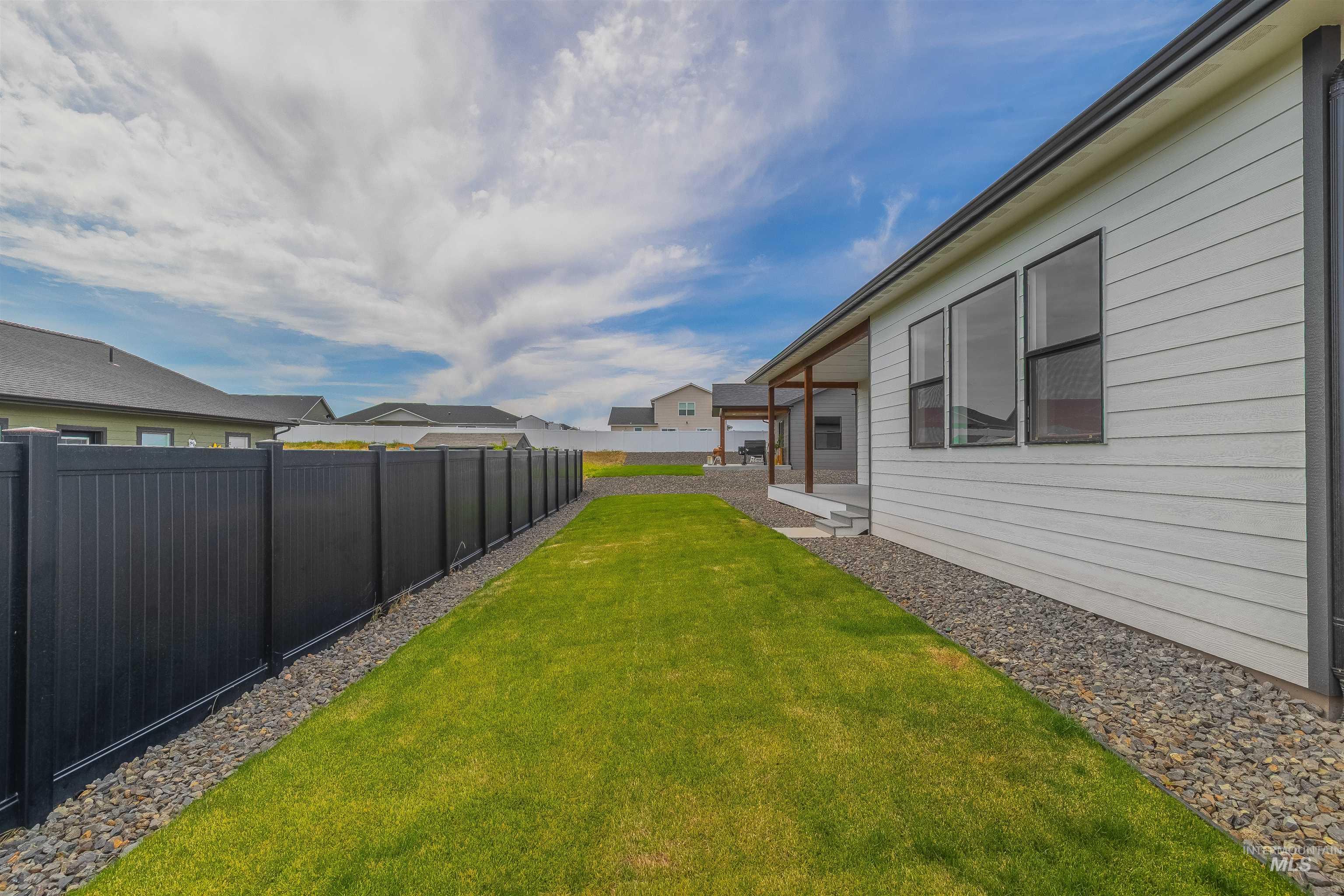 1724 Pathway Court Lewiston, ID 83501 - Photo 36 of 38 Fenced backyard featuring a patio area and a residential view