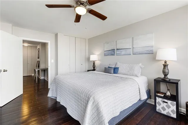 a bedroom with bed and a walk in closet