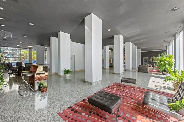 a living room with furniture and a rug