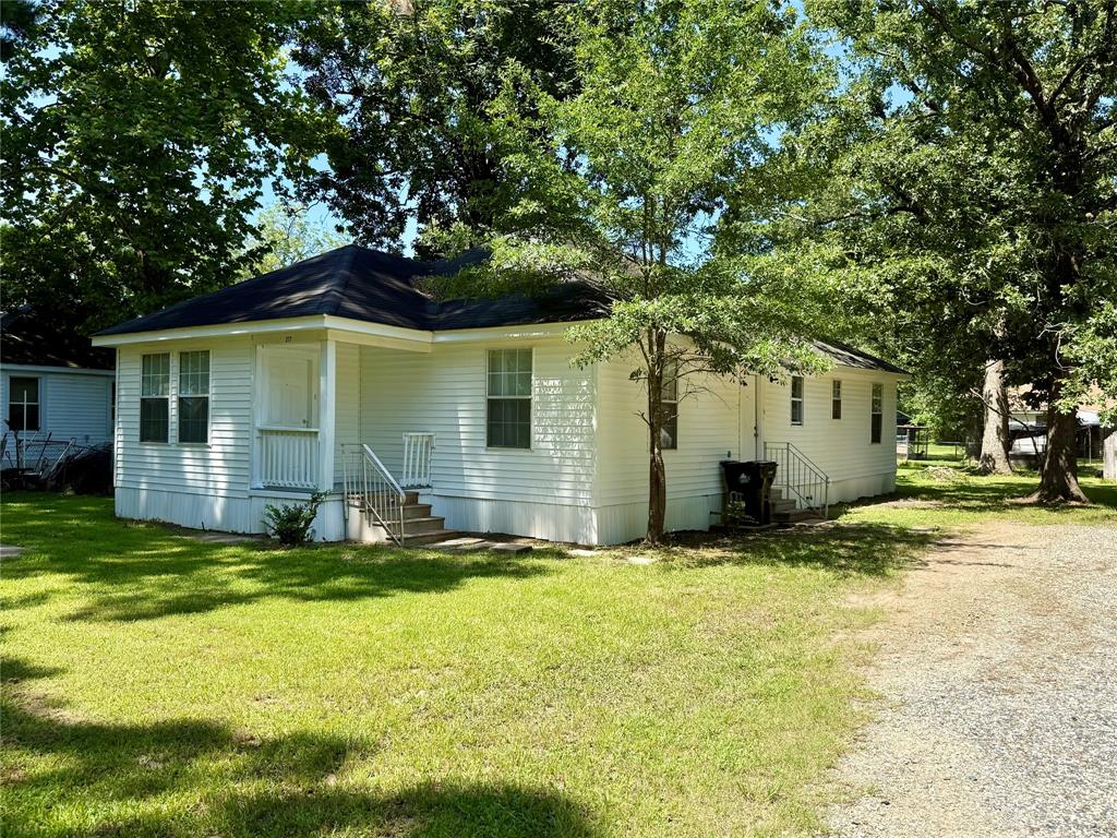 217 3rd St Pinehill Springhill, LA 71075 - Photo 3 of 23 Single-story residence featuring white siding and a dark shingle roof