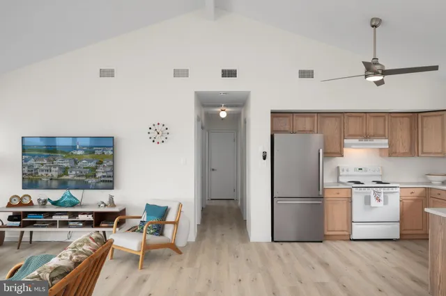a kitchen with a sink cabinets and window