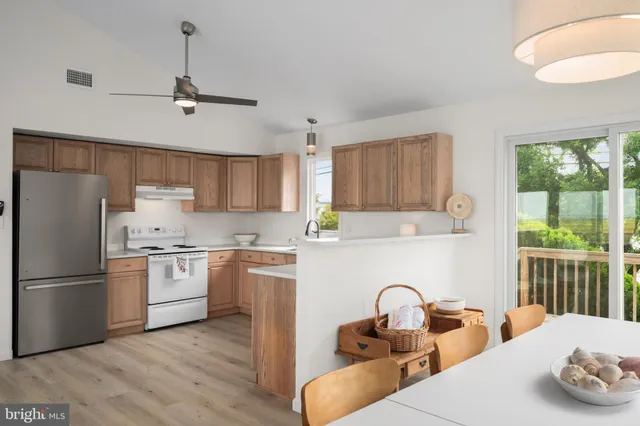 a view of a terrace with lawn chairs
