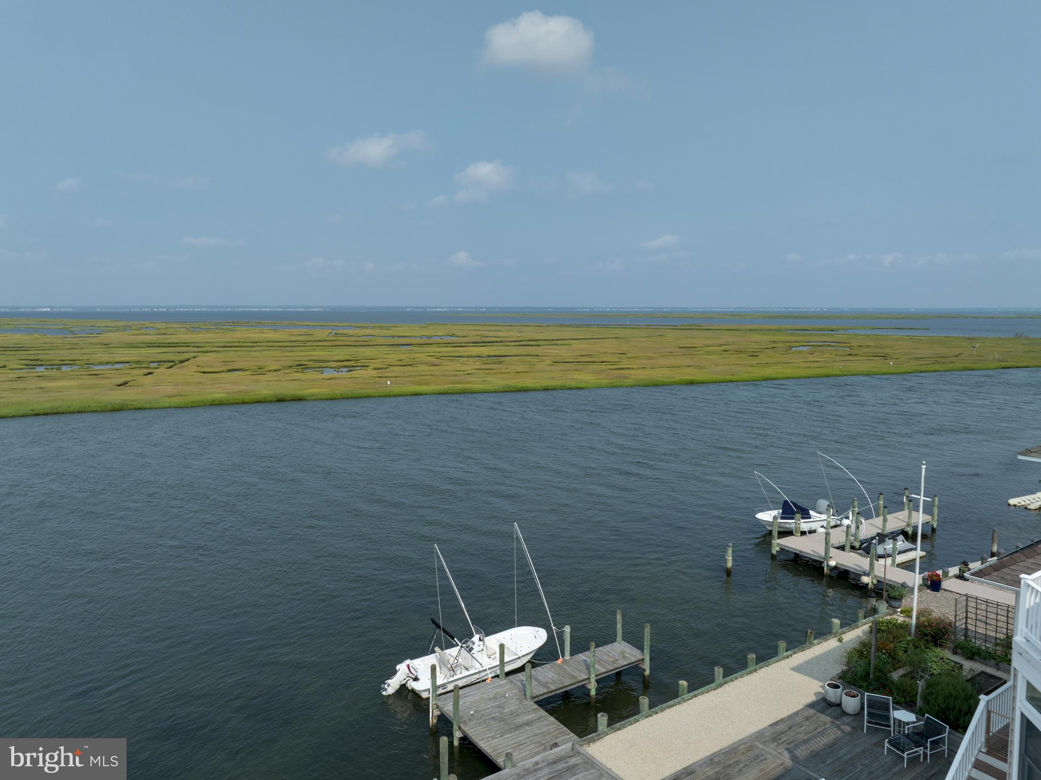 26 Butler Road Long Beach Township, NJ 08006 - Photo 18 of 44 a view of a terrace with lawn chairs