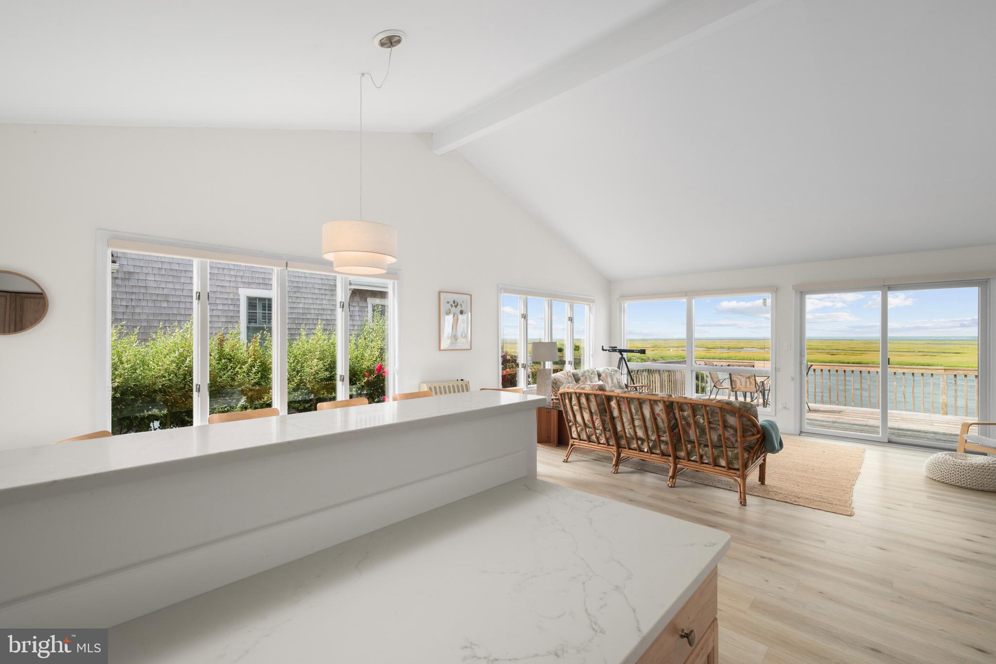 26 Butler Road Long Beach Township, NJ 08006 - Photo 22 of 44 a living room with furniture and large windows