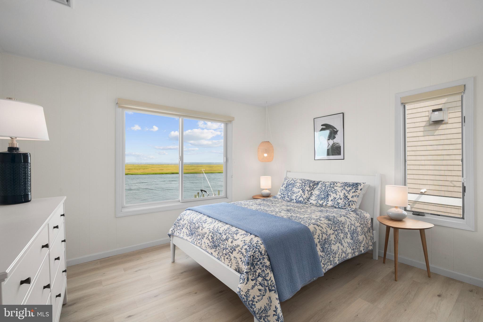 26 Butler Road Long Beach Township, NJ 08006 - Photo 27 of 44 a bedroom with a bed and a window