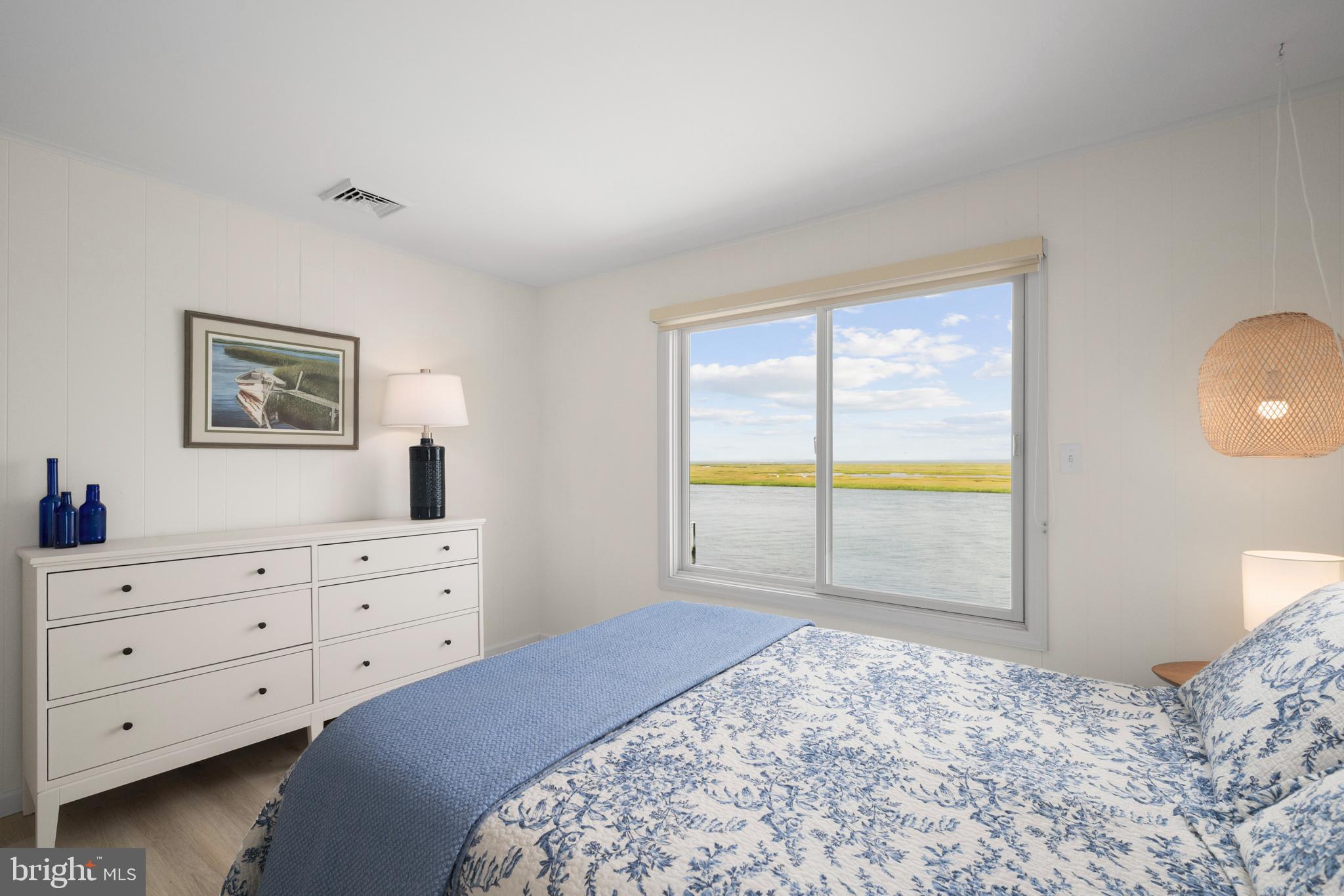 26 Butler Road Long Beach Township, NJ 08006 - Photo 28 of 44 a bedroom with a bed and a window