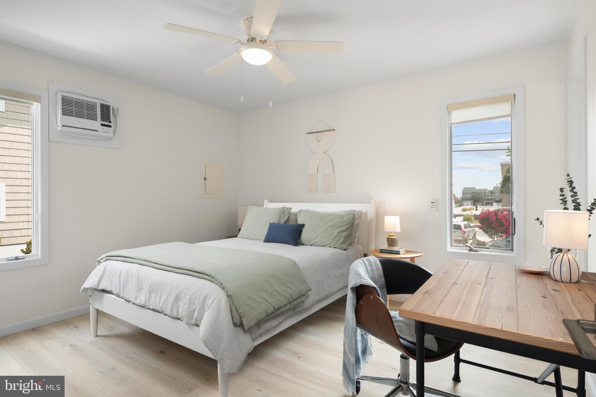 26 Butler Road Long Beach Township, NJ 08006 - Photo 30 of 44 a bedroom with a bed and wooden floor