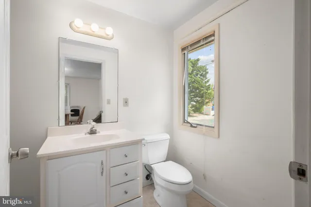a view of a house with backyard porch and sitting area