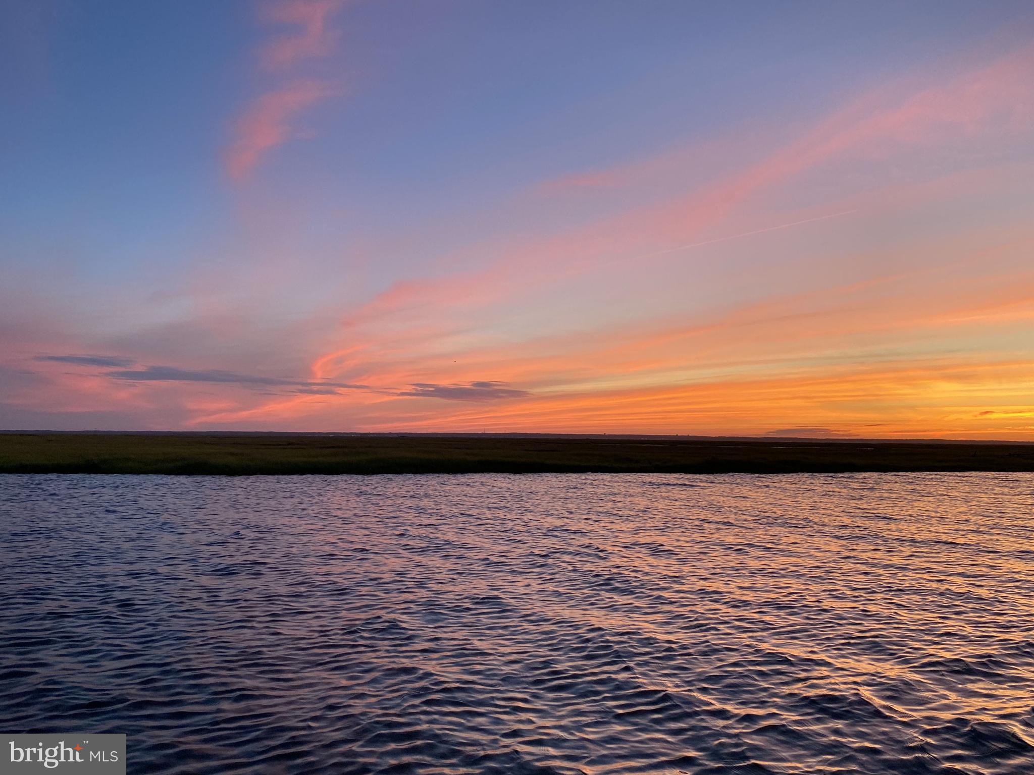 26 Butler Road Long Beach Township, NJ 08006 - Photo 4 of 44 a view of ocean with sunset