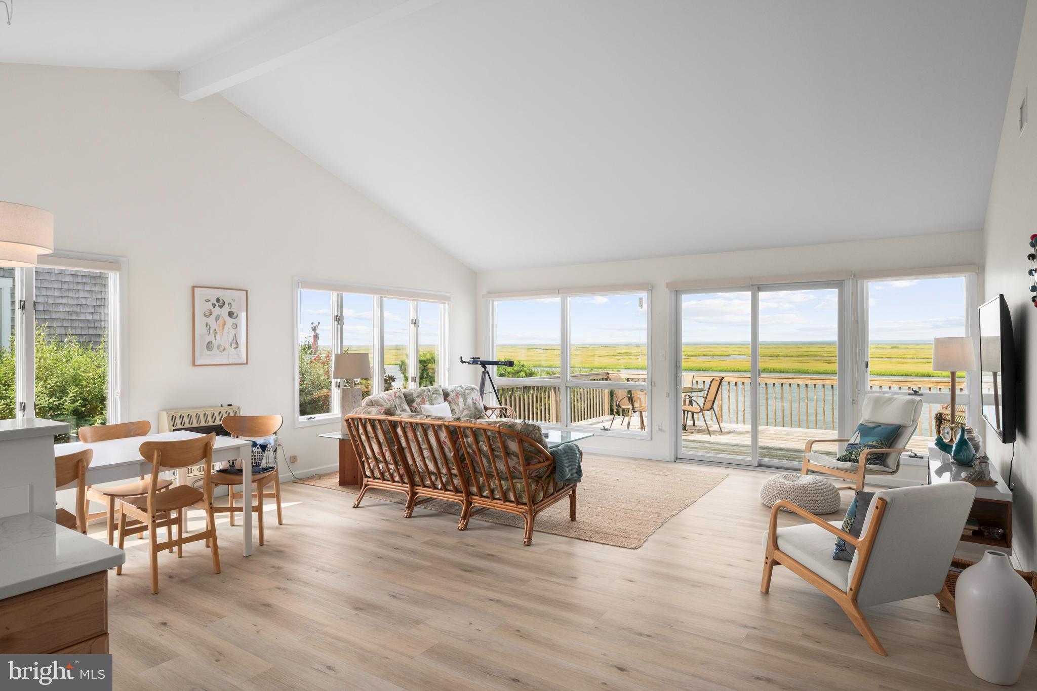 26 Butler Road Long Beach Township, NJ 08006 - Photo 10 of 44 a living room with furniture and large windows