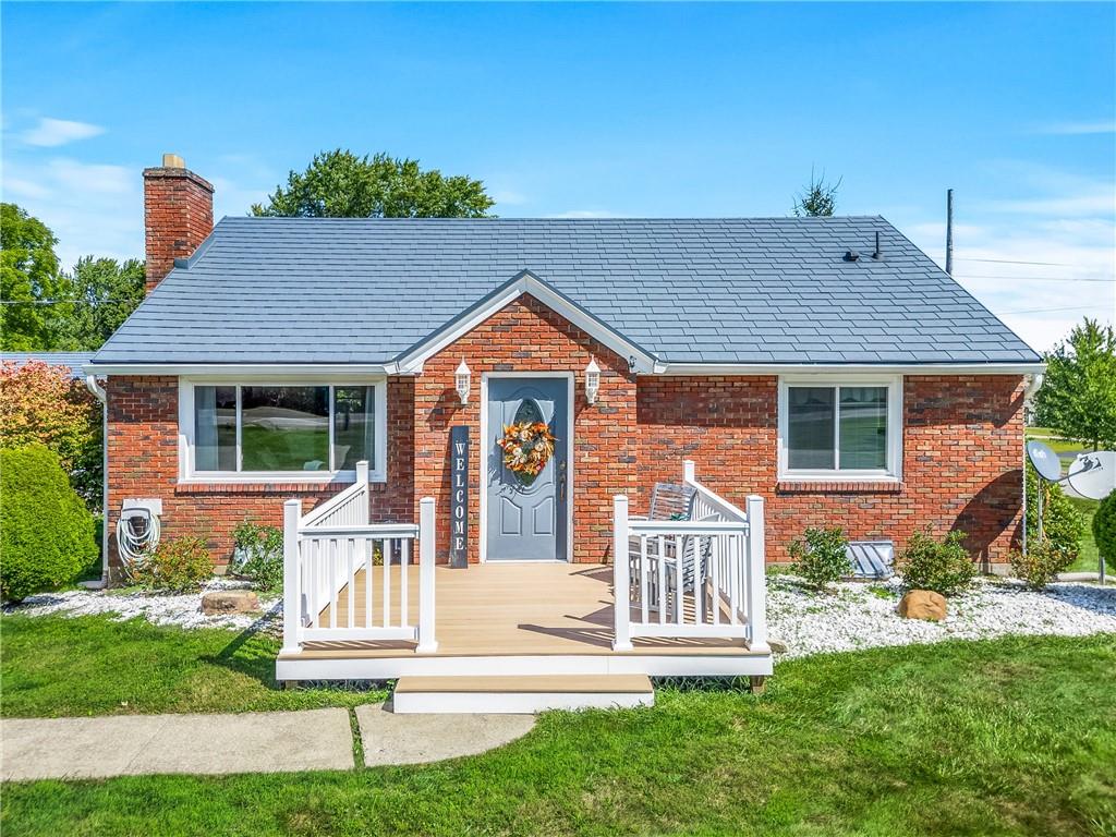 3434 Mitchell Road New Castle, PA 16105 - Photo 1 of 10 a front view of a house with a yard