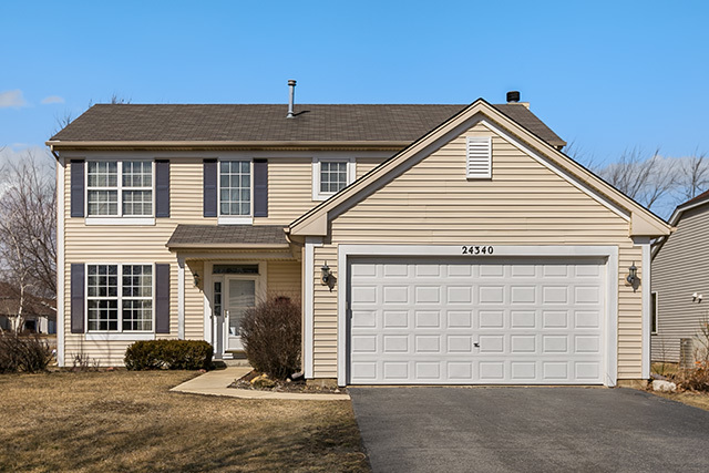 a front view of a house with a garage