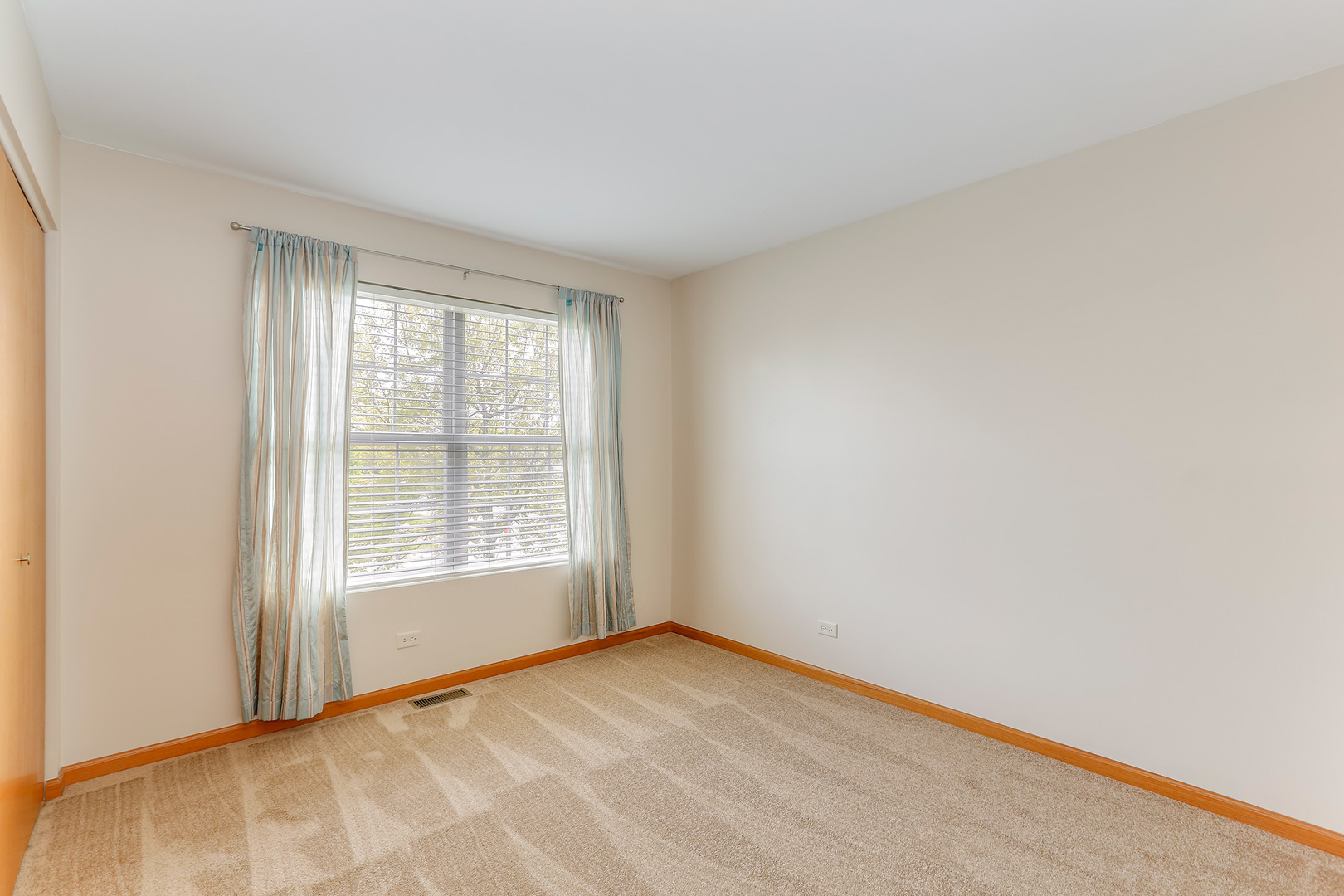 24340 Hemlock Drive Plainfield, IL 60585 - Photo 17 of 33 a view of an empty room with a window