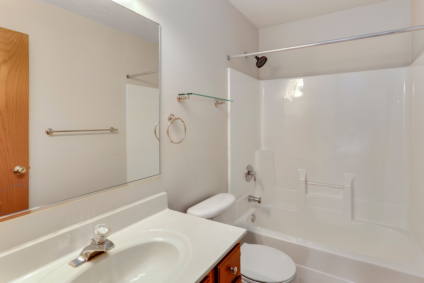 24340 Hemlock Drive Plainfield, IL 60585 - Photo 18 of 33 a bathroom with a sink toilet and shower