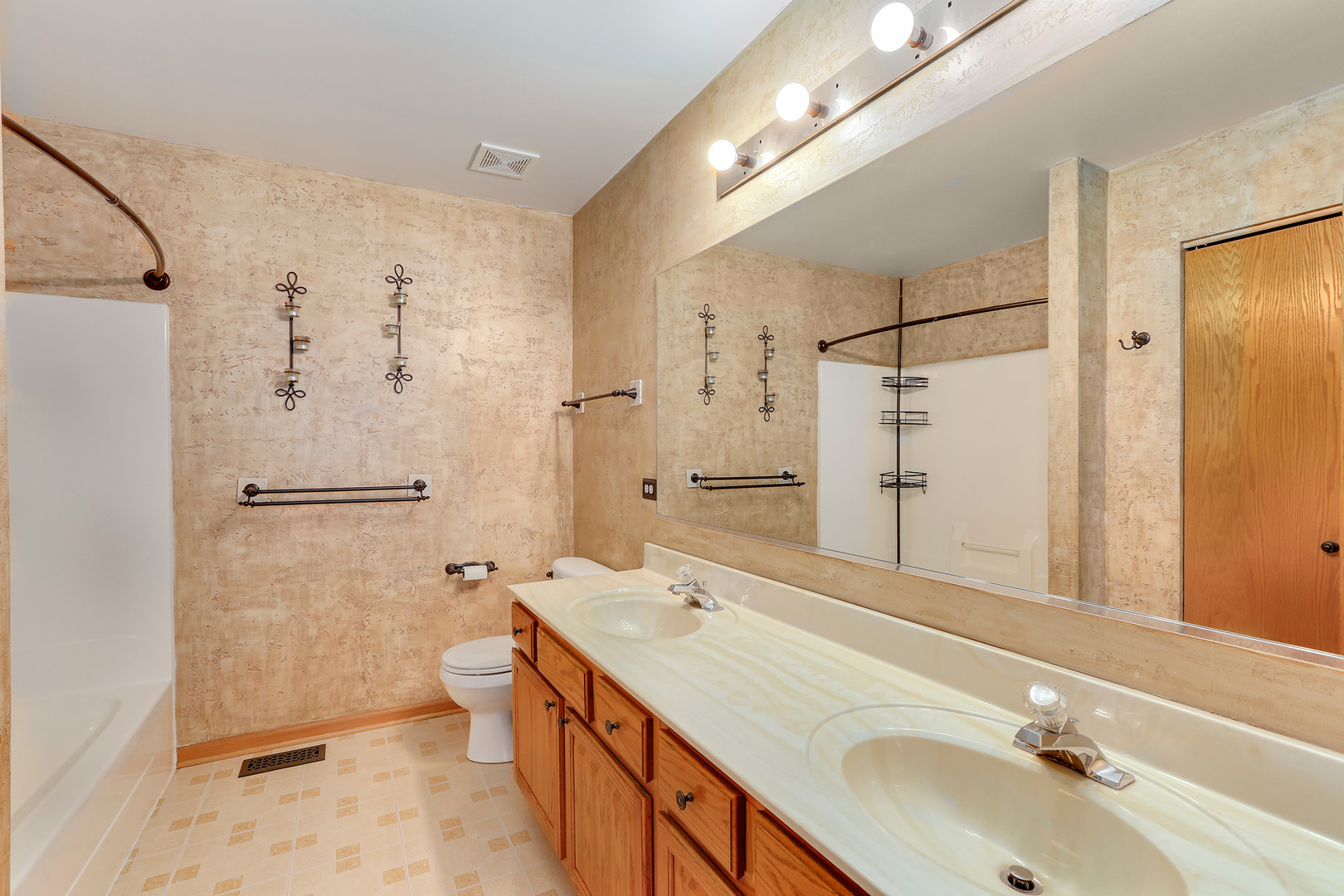 24340 Hemlock Drive Plainfield, IL 60585 - Photo 25 of 33 a bathroom with a double vanity sink toilet mirror and shower
