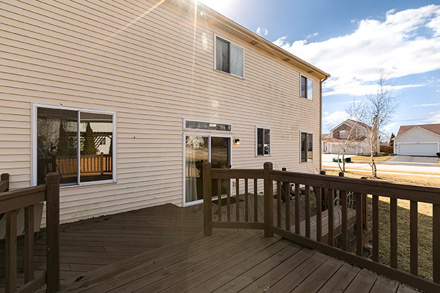 24340 Hemlock Drive Plainfield, IL 60585 - Photo 27 of 33 a view of a house with wooden deck